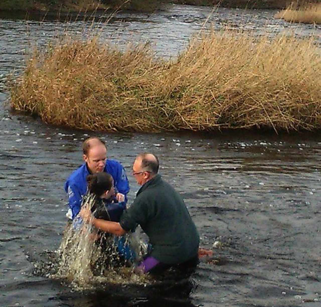 Hannah being baptised in the river