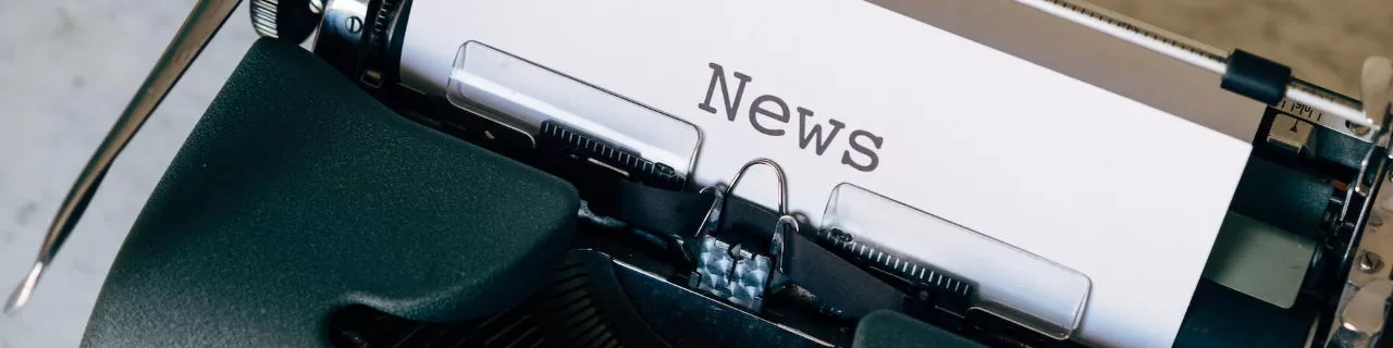 Picture of typewriter with news coming out